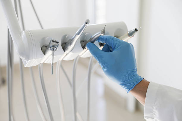 Professional Tooth Extraction technician working in Bettendorf, IA